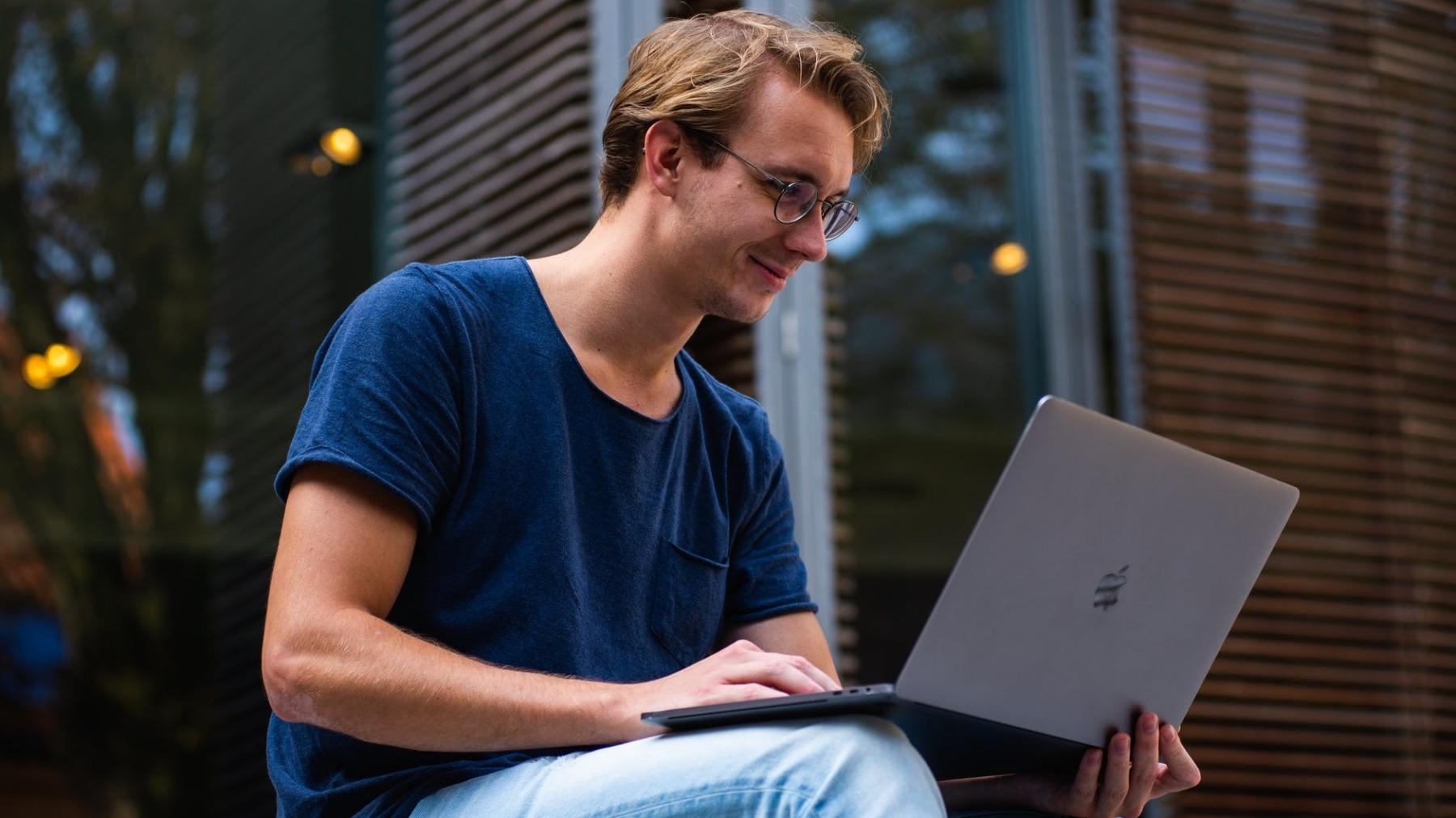 selective focus photo of man using laptop