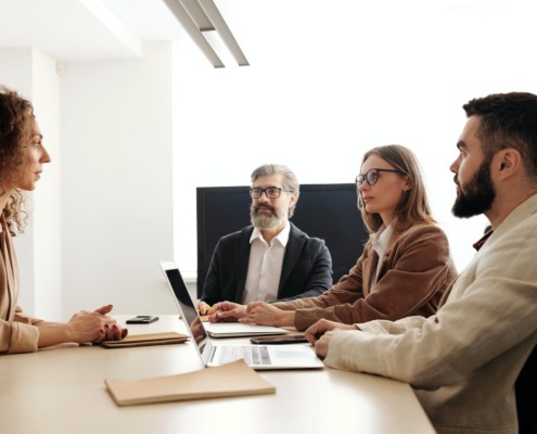 man people woman desk